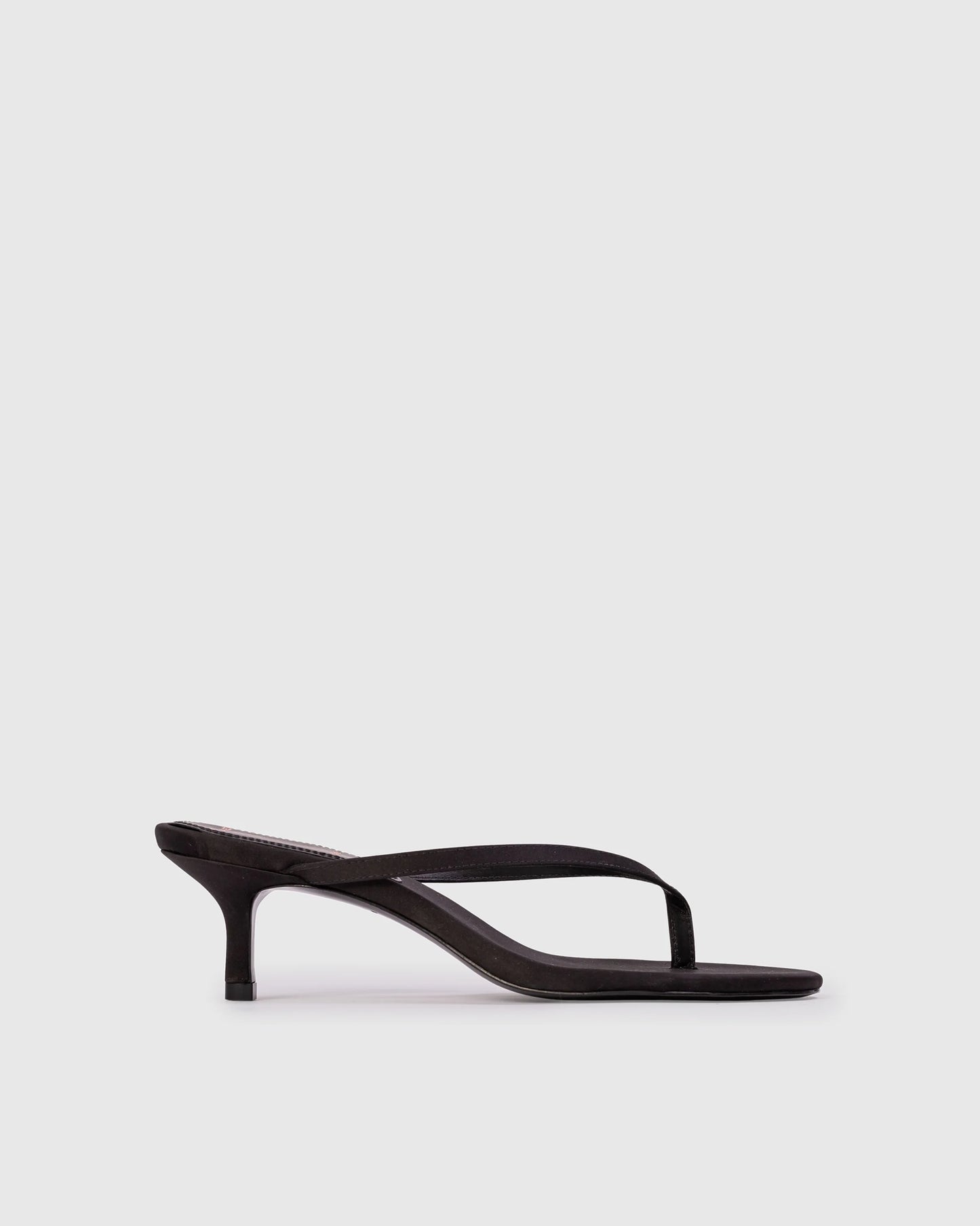 Black Suede Studio Tash 50: round toe thong slipper mule, set on a curved low heel. Made with crepe satin, women's shoes