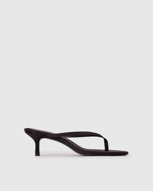 Black Suede Studio Tash 50: round toe thong slipper mule, set on a curved low heel. Made with crepe satin, women's shoes