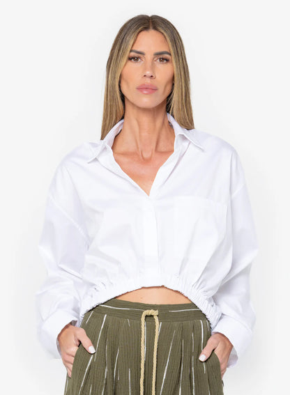 The Emery Top by JBQ in White features a cropped fit, dropped shoulders, chest pocket, and self-tie waistband, women's clothing