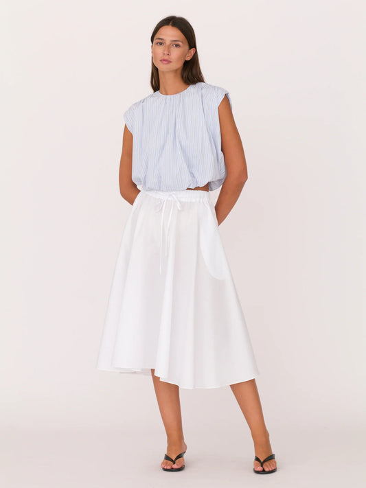 Secular Angie Skirt is an easy, feminine staple, with side pockets and side slits. An elastic waistband with an adjustable drawstring 